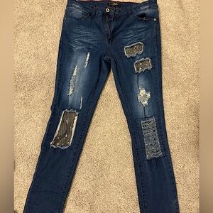 Distressed Sequence Patch Jeans